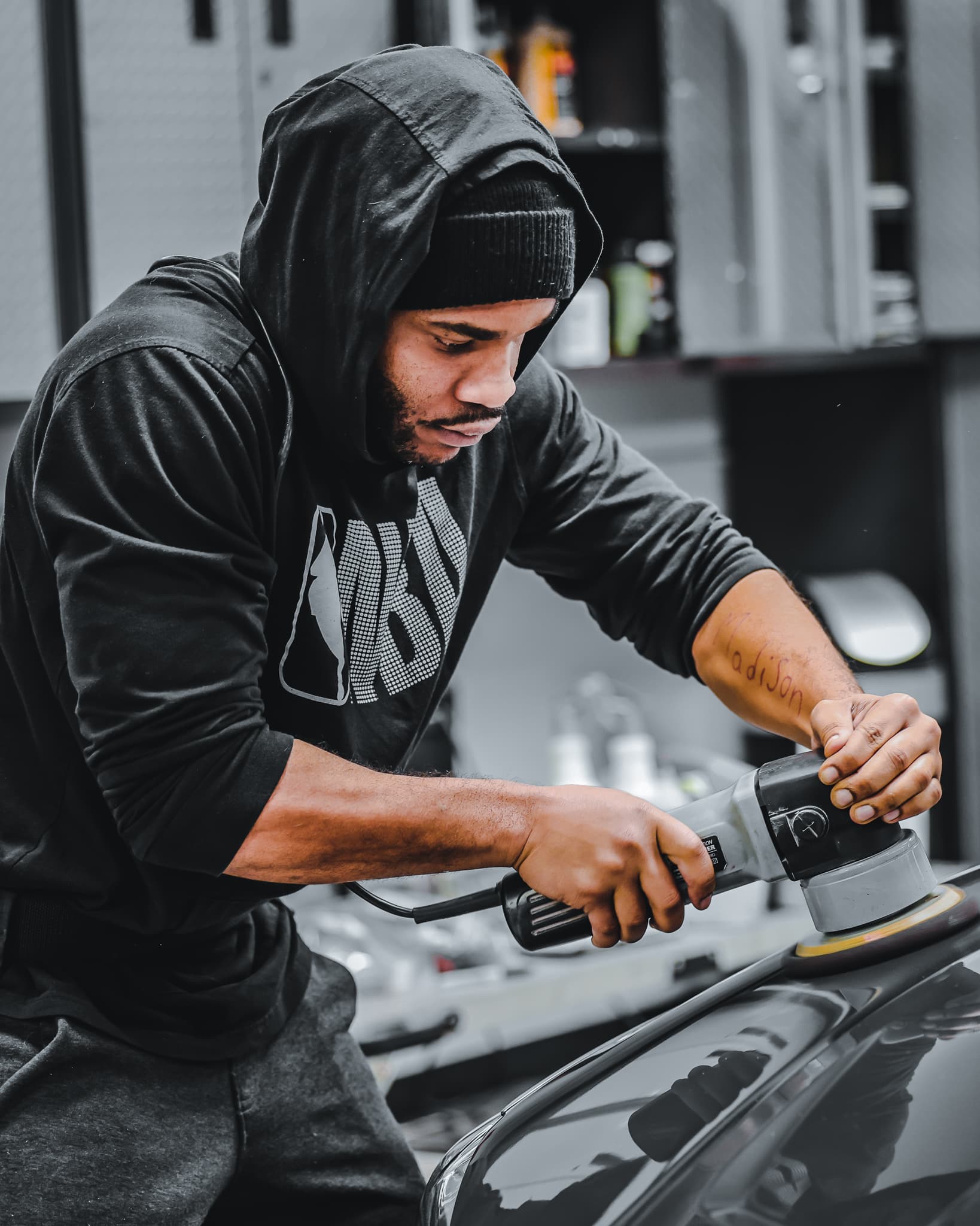 A vehicle being professionally detailed to a clean finish